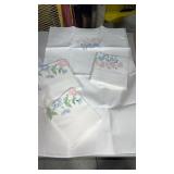 Set of two embroidered white pillowcases