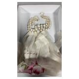 Vintage short waist apron, and a pearl necklace