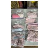 7 Ziploc, baggies of newborn, baby clothes, used