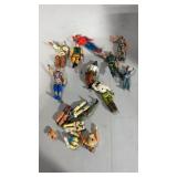 9 toy figures and parts and pieces