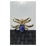 Gold tone spider brooch