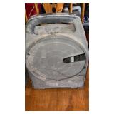 Craftsman's retractable extension cord holder.