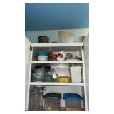 Cupboard of miscellaneous containers and glass
