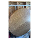 Round wooden table and six chairs. 2 leafs