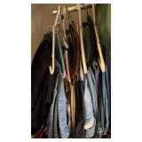 Group of men's  jeans and more hanging clothes
