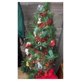 Artificial Christmas tree with ornaments,