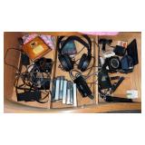 Drawer of miscellaneous items headphones , and