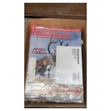 Box of bow, hunter magazines and more