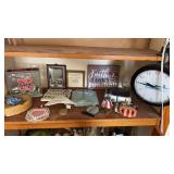Shelf of decorative items , clock and more