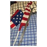 2 American flags and poles