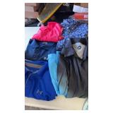Tote of menï¿½s clothes. Sizes range from small,