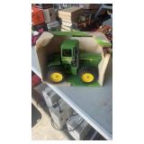 ERTL 1:16 Scale John Deere 4-Wheel Drive Tractor.