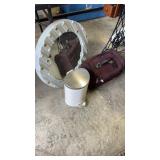 Wall mirror , bathroom trash can and luggage