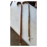 2 wooden canes with pointy tips