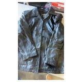 Womanï¿½s leather button up jacket
