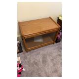 Wood cabinet with glass doors.