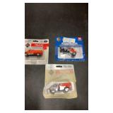 3 HO Scale Die Cast Dump Trucks, 1 is