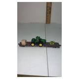 John Deere toy tractor on. Southern flat bed. HO