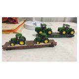 HO scale  flat cars with John Deere tractors
