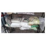 SHELF FULL OF CURTAINS/ LINENS