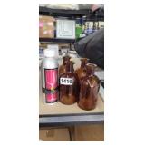 4 BROWN GLASS BOTTLES AND RED WINE REMOVER
