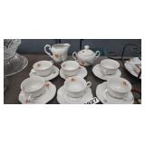 TEA CUPS AND SAUCERS WITH CREAMER AND SUGAR