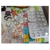 LOT OF COOKIE CUTTERS AND (2) MUFFIN PANS