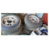2 STACKS OF TIRES WITH RIMS