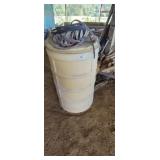 INDUSTRIAL PLASTIC DRUM WITH STRAPPING ON TOP