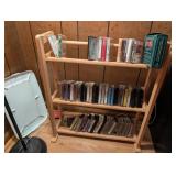 WOODEN RACK OF CASSETTE TAPES
