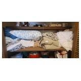 SHELF FULL OF LINENS