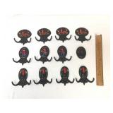 Lot of 11 Cast Iron Fire Plaque Coat Hooks and 1 P
