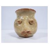 Unique face pottery piece