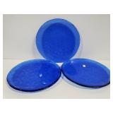 Trio of blue glass flower plates