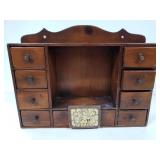 Dark wood shelf with drawers