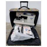 White embroidery machine with accessories