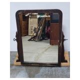 Old vintage vanity mirror on wood