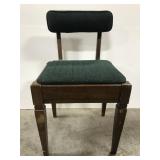 Vintage cushioned chair with storage