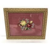 Floral needlework in ornate frame