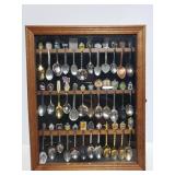 Souvenir spoons in wood display case