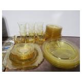 Assorted styles of yellow glass dishes
