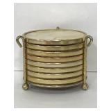 Eight iridescent gold trimmed coasters with stand