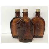 Three vintage Bicentennial Log Cabin syrup bottles