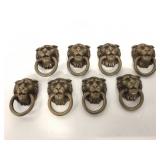 Eight Lion head drawer pulls