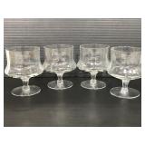 Four stemmed small snifter glasses