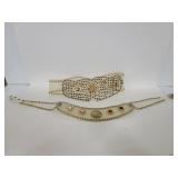 Pair of vintage clear vinyl studded belts