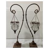 Pair of cast metal hooks w/ glass lanterns