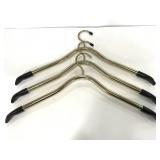 Three thick gold toned hangers