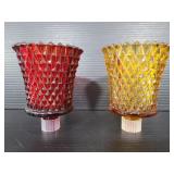Red and yellow glass candle pieces