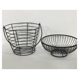 Two black metal wire baskets